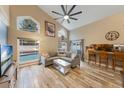 Open-concept living room with natural light and sliding glass doors leading to outdoor space at 1010 Sugarberry Trl, Oviedo, FL 32765