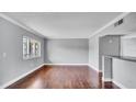 Open floor plan showcasing hardwood floors and a seamless flow into other living spaces at 115 Oyster Bay Cir # 260, Altamonte Springs, FL 32701