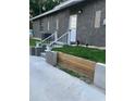 The back entrance has a white door with stone-like additions on a simple yet stylish design at 1611 Creekwood Run, Lakeland, FL 33809