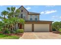 Charming two-story home with a three car garage and beautiful stone and brick facade at 1710 Bridgets Ct, Kissimmee, FL 34744