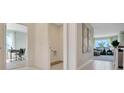 Hallway featuring bright walls, tile flooring, with office and living spaces off of it at 203 Taylor Groves Dr, Lake Wales, FL 33853
