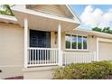 Charming home exterior with a welcoming porch, neat landscaping, and clear address numbers at 326 Evergreen Ct, Apopka, FL 32712