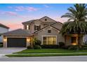 Beautiful two-story home with a tile roof, well-maintained landscaping, and an attached two-car garage at 3647 Farm Bell Pl, Lake Mary, FL 32746