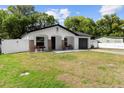 Inviting single-story home with a tidy front lawn and a charming, fenced yard at 376 Orange Ave, Longwood, FL 32750