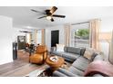 Comfortable living space featuring a sectional sofa, stylish decor, and bright natural light at 376 Orange Ave, Longwood, FL 32750
