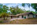 Exterior view of a home with a brick patio and lush greenery at 530 Webster St, Lake Mary, FL 32746