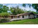 Spacious backyard featuring a brick patio, lush green grass, and well-maintained landscaping for outdoor enjoyment at 530 Webster St, Lake Mary, FL 32746