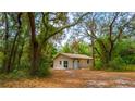 External shot of home surrounded by large trees at 530 Webster St, Lake Mary, FL 32746