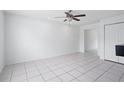 Spacious living room features tile floors, a ceiling fan, and natural light at 611 Casa Park A Ct, Winter Springs, FL 32708