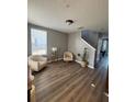 Inviting living room with neutral colors and modern wood-look flooring at 6258 Westcott Cove Blvd, Orlando, FL 32829