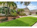 Beautiful landscaping surrounds this well maintained home at 10222 Marsh Pine Cir, Orlando, FL 32832