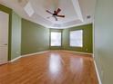 Spacious bedroom featuring a trey ceiling, fan, and dual windows at 1432 Stargazer Ter, Sanford, FL 32771
