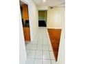 This is a light and bright hallway that has hardwood and tile floors with an open concept to the rooms at 248 Crown Oaks Way, Longwood, FL 32779
