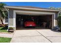 Spacious two-car garage featuring ample storage and an epoxy floor at 2863 Middleton Cir, Kissimmee, FL 34743