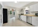 Bright kitchen with stainless steel appliances, white cabinets, and ample counter space at 2918 Croton Rd, Apopka, FL 32703