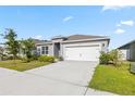 Beautiful single Gathering home featuring a 2-car garage and a well maintained, landscaped yard at 3341 Lounging Wren Ln, Bartow, FL 33830