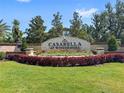 Entrance to the prestigious Casabella at Windermere community featuring lush landscaping and manicured lawns at 4047 Isabella Cir, Windermere, FL 34786