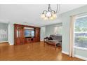 Bright living room with hardwood floors and ample natural light at 5452 E Michigan St # 7, Orlando, FL 32812