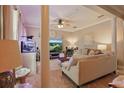 Comfortable living room with neutral tones, tile flooring, and elegant furnishings at 5489 Baldwin Park St, Orlando, FL 32814