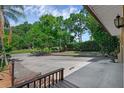 Wide driveway with space for multiple cars, leading to a nicely landscaped yard at 670 N Sparkman Ave, Orange City, FL 32763