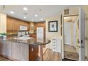 Well-equipped kitchen boasting sleek granite countertops, modern appliances, and convenient breakfast bar seating at 7630 Heritage Crossing Way # 302, Reunion, FL 34747