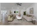 Bright living room features recessed lighting, ceiling fan, tile floors, and neutral paint colors at 7664 Clubhouse Estates Dr, Orlando, FL 32819