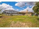 Large backyard with screened pool, offering privacy and space for outdoor activities at 10585 Sw 38Th Ave, Ocala, FL 34476