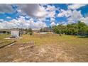 Expansive backyard featuring ample space, a shed, and mature trees at 10585 Sw 38Th Ave, Ocala, FL 34476