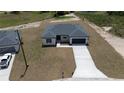 Well-situated home in a peaceful neighborhood, highlighting its curb appeal and surrounding residences at 13253 Sw 83Rd Cir, Ocala, FL 34473