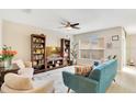 Bright living room with comfortable seating and a large window at 13622 Cygnus Dr, Orlando, FL 32828