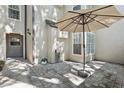 Private patio featuring stone pavers, a retractable awning and lush landscaping for outdoor relaxation at 1578 Farrindon Cir # 1578, Lake Mary, FL 32746