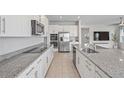 Modern kitchen featuring granite countertops and stainless steel appliances at 1616 Eucalyptus Way, Davenport, FL 33837