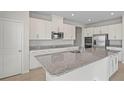 Modern kitchen featuring granite countertops and stainless steel appliances at 1616 Eucalyptus Way, Davenport, FL 33837