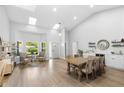 Open living space featuring large windows, skylights and a seating area at 1667 Spring Loop Way, Winter Garden, FL 34787