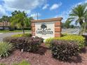 Attractive Carrington Park community sign surrounded by lush landscaping and palm trees at 2426 Branch Way # 200, Maitland, FL 32751