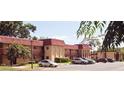 Exterior view of well-maintained condo buildings and convenient parking at 2810 N Powers Dr # 59, Orlando, FL 32818