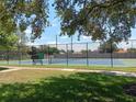 Outdoor tennis court at the Oak Shadows Condominiums in a park like setting at 2810 N Powers Dr # 59, Orlando, FL 32818
