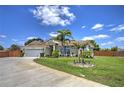 Charming one-story home featuring lush landscaping, a well-maintained lawn, and a spacious two-car garage at 2850 Babylon Ct, Oviedo, FL 32765