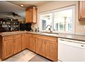 Bright kitchen featuring light wood cabinetry, neutral countertops, and stainless steel appliances at 2900 Cullen Lake Shore Dr, Belle Isle, FL 32812