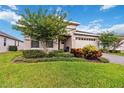 Beautiful home with a well-manicured lawn and landscaped front yard and a brick driveway at 3397 Sagebrush St, Harmony, FL 34773