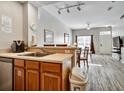 Bright and open kitchen with a breakfast bar overlooking the dining and living areas at 4560 Spigold Court, Kissimmee, FL 34746