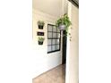 Cozy front porch with hanging plants and a decorative welcome sign at 5284 Indian Laurel Ct, Orlando, FL 32808