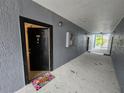 Inviting condo entrance featuring unit 4611, and a 'hello' welcome mat at 5525 Pga Blvd # 4611, Orlando, FL 32839