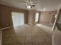 Comfortable living room with tile floors, natural lighting, and ceiling fan at 5525 Pga Blvd # 4611, Orlando, FL 32839