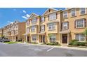 Lovely townhomes with brick shutters, tidy landscaping, and a convenient parking area at 628 Pensacola Ln # 628, Lake Mary, FL 32746