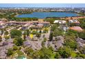 Community aerial view showcasing lush surroundings, serene lake views, and proximity to nearby amenities in a desirable area at 7254 Della Dr, Orlando, FL 32819