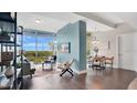 Inviting living space with modern furnishings, expansive windows, and hardwood floors, providing lots of natural light at 101 S Eola Dr # 812, Orlando, FL 32801