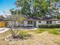 Lovely home with updated front yard landscaping and a blooming Crape Myrtle at 1298 Scottsdale Dr, Ormond Beach, FL 32174