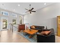 Bright living room featuring tile flooring, high ceilings and recessed lighting, providing a welcoming atmosphere at 13865 Granger Ave, Orlando, FL 32827