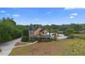 A stunning two-story home featuring a turret and a backyard with a pool at 1415 Brumley Rd, Chuluota, FL 32766